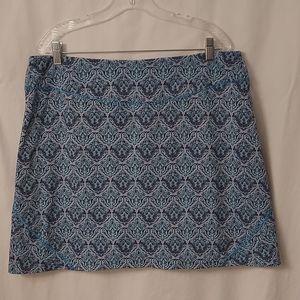 Beautifully patterned skirt with navy shorts underneath.